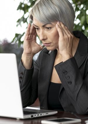 front-view-business-woman-looking-laptop-scaled.jpg