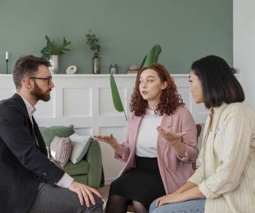 people-having-debate-while-looking-computer